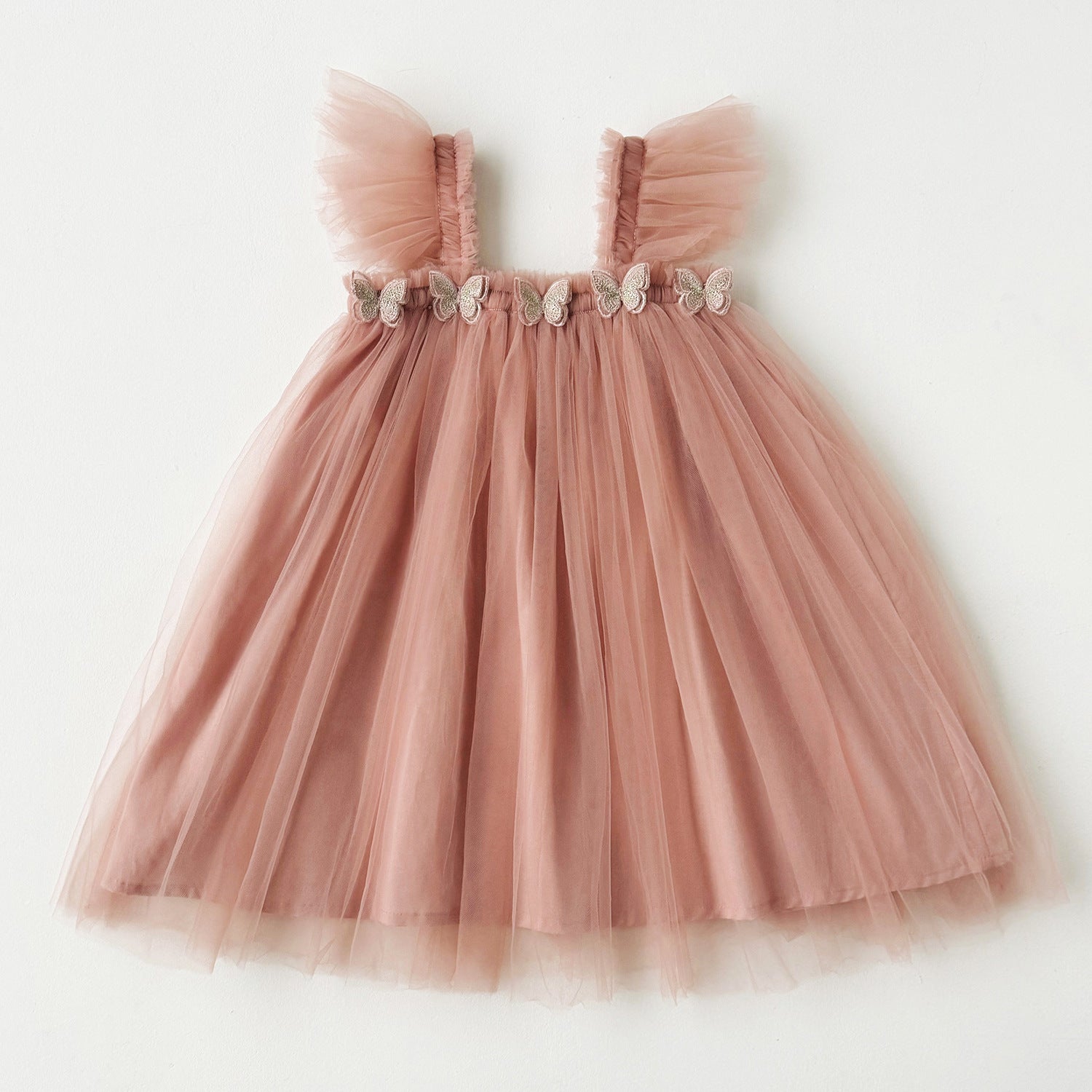 Pink tulle dress with butterfly details on a white background